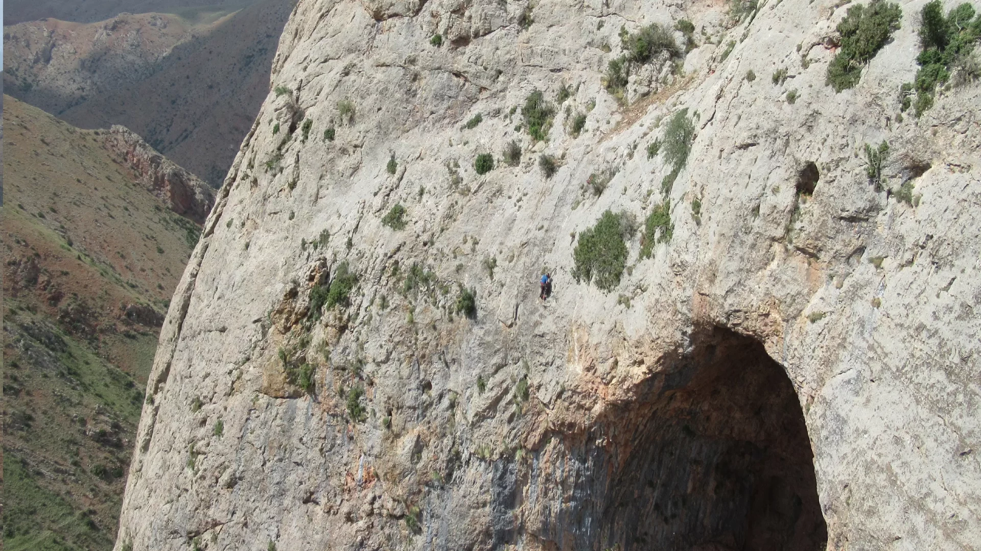 Abseiling Down To Investigate A Big Open Entrance Near Gnishik (© John Proctor)